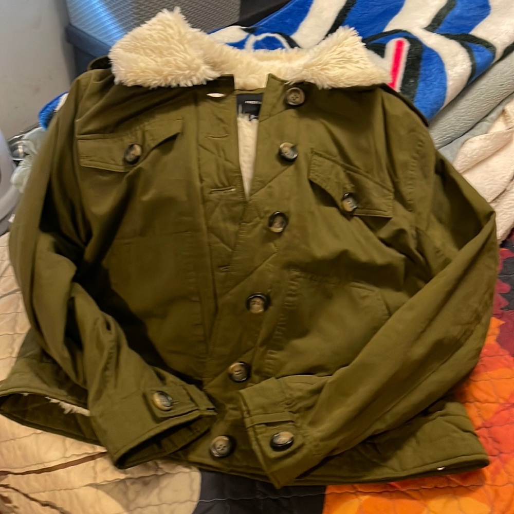 Green L jacket with fur inside. This jacket was worn once.